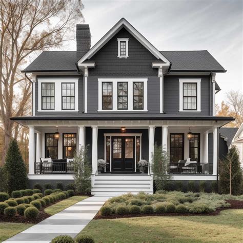 gray house with white metal roof|gray exterior with black trim.